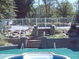 hardscape steps and pondless waterfalls in pool area
